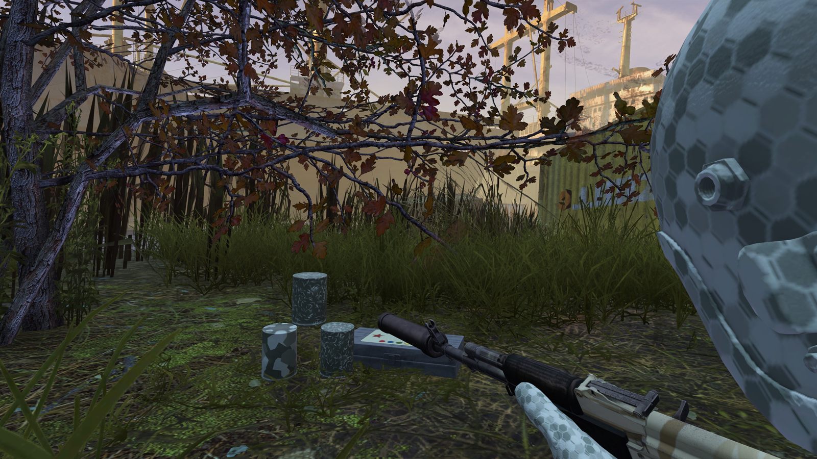 Paint cans and an advanced paint kit on the ground next to a painted rifle and helmet